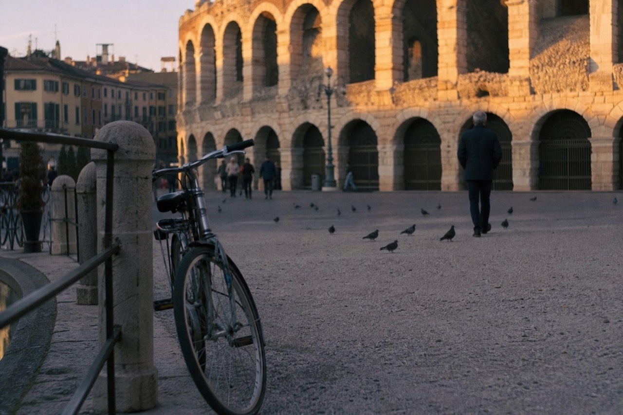 Verona's Piazza Bra at sunset with the Arena, no text, no logos, no people