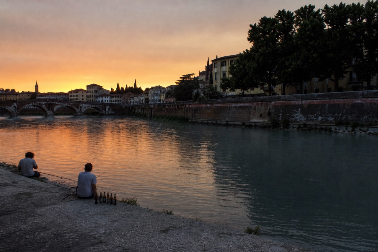 Verona's historic centre with the Adige river and old bridges at golden hour, no text, no logos, no people