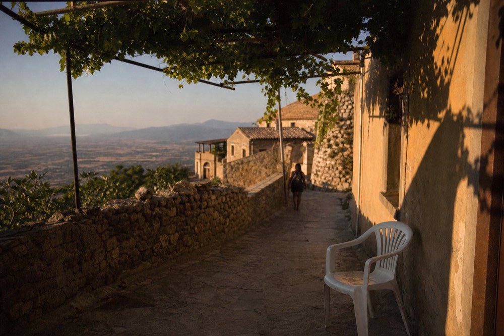 Stone alleys and vineyard terraces of a Valpolicella hill village, no text, no logos, no people