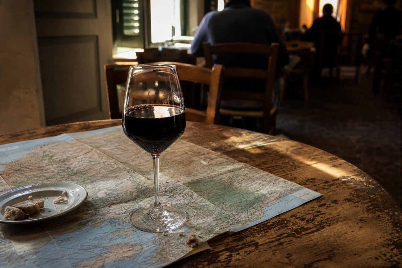 Amarone wine glass on a map of Verona, no text, no logos, no people