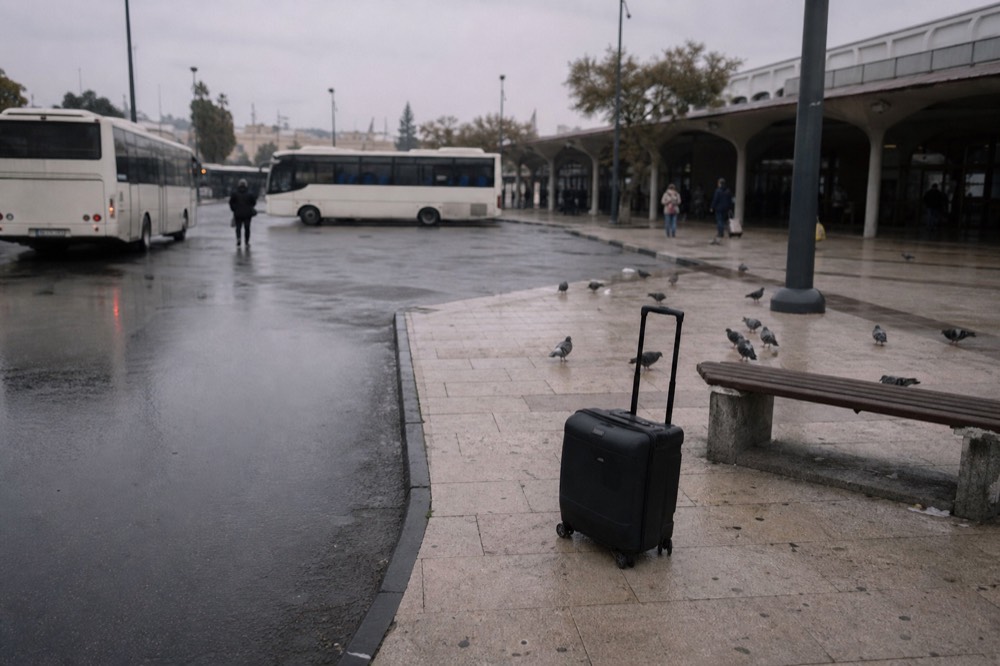 Verona Porta Nuova station forecourt in morning light with trams and buses, no text, no logos, no people