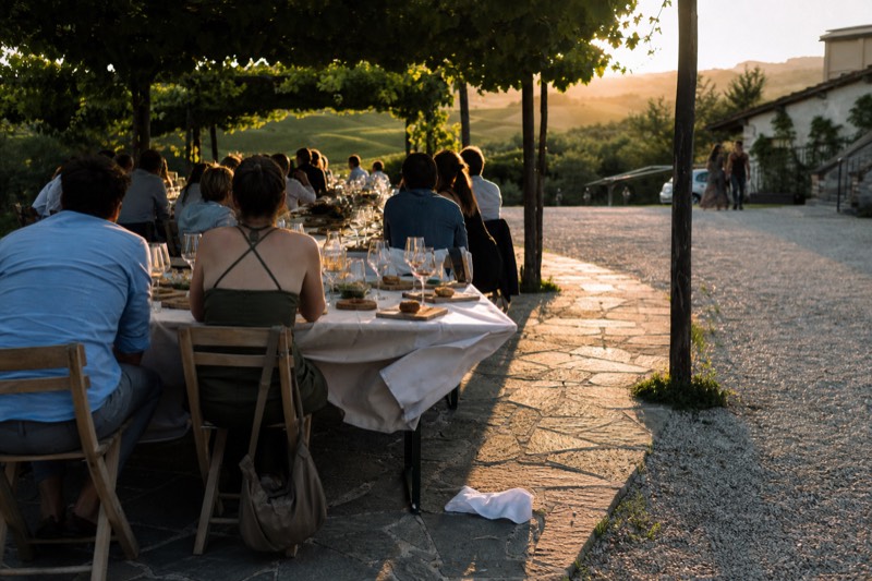 Long lunch table set under a pergola at a winery between Soave and Valpolicella